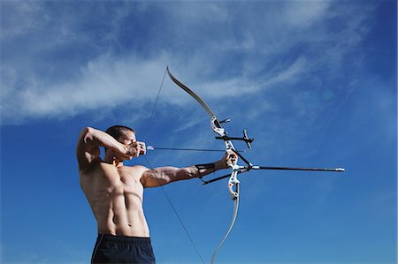 Man Practicing Archery Stock Photo - Rights-Managed, Code: 858-06617627