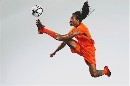 dynamic - Man In Soccer Uniform With Ball Stock Photo - Rights-Managed, Code: 858-06617776