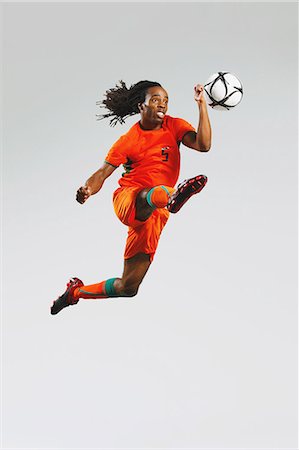 forcefully - Man In Soccer Uniform With Ball Stock Photo - Rights-Managed, Code: 858-06617779