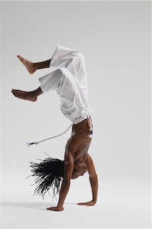 Man Practicing Capoeira Stock Photo - Rights-Managed, Code: 858-06617788