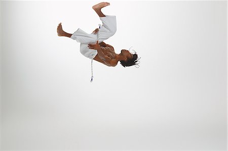 simsearch:6122-08212737,k - Man Practicing Capoeira Stock Photo - Rights-Managed, Code: 858-06617797