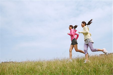 simsearch:858-03050428,k - Friends Jogging On Grass Stock Photo - Rights-Managed, Code: 858-06756057