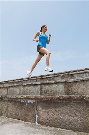 Woman Running On Seawall Stock Photo - Rights-Managed, Code: 858-06756089