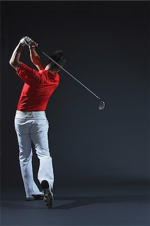 stroke (racket sports and golf) - Golfer Swinging,  Rear View Stock Photo - Rights-Managed, Code: 858-06756124