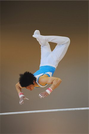 simsearch:858-03047740,k - Gymnast reaching for uneven parallel bars Stock Photo - Rights-Managed, Code: 858-03047733
