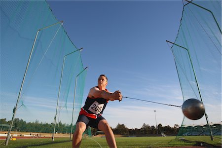 Hammer throw athlete approaching his release Foto de stock - Con derechos protegidos, Código: 858-03048189