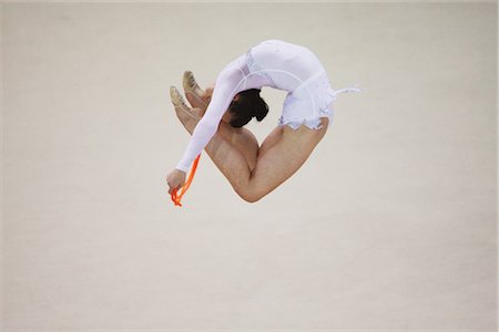 Young woman performing rhythmic gymnastics with rope Stock Photo - Rights-Managed, Code: 858-03048922