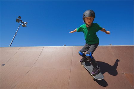 determined youth sports - Boy jumping with skateboard in skate park Stock Photo - Rights-Managed, Code: 858-03049285