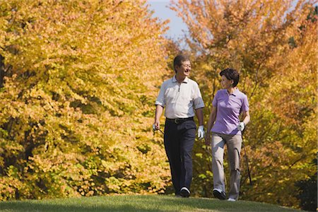 simsearch:858-03050428,k - Golfers walking together in golf course Stock Photo - Rights-Managed, Code: 858-03049301