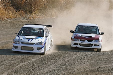 dusty environment - Two cars competing in rally Stock Photo - Rights-Managed, Code: 858-03049369