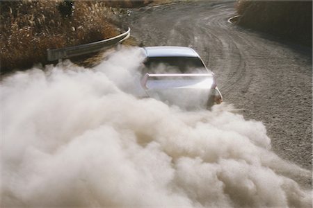 dusty environment - Race car sliding through a forest corner Stock Photo - Rights-Managed, Code: 858-03049375