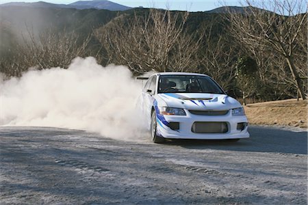 dusty environment - Rally car and clouds of dust Stock Photo - Rights-Managed, Code: 858-03049379