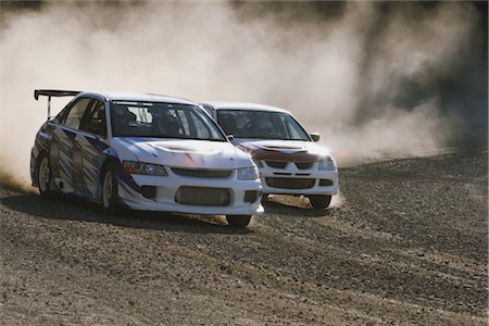 dusty environment - Two cars competing in rally Stock Photo - Rights-Managed, Code: 858-03049370