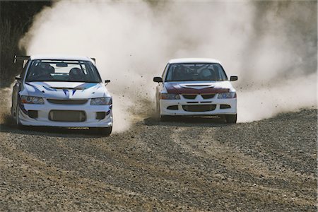 dusty environment - Rally cars with cloud of dust and flying dirt Stock Photo - Rights-Managed, Code: 858-03049372