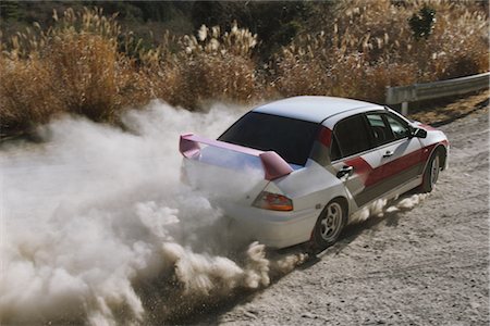 dusty environment - Race car sliding through a forest corner Stock Photo - Rights-Managed, Code: 858-03049373