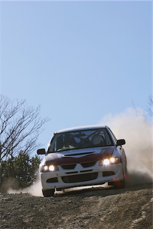 dusty environment - Rally car racing on racecourse Stock Photo - Rights-Managed, Code: 858-03049382