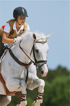 simsearch:858-03050485,k - Woman jumping on horse Stock Photo - Rights-Managed, Code: 858-03049396
