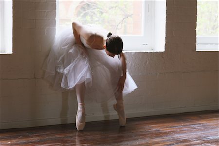 Ballet dancer looking at his slippers in window Stock Photo - Rights-Managed, Code: 858-03049486