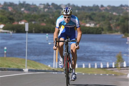 simsearch:400-08938779,k - Cyclist cycling on road Stock Photo - Rights-Managed, Code: 858-03049514