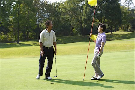 simsearch:858-03050428,k - Couple playing golf together Stock Photo - Rights-Managed, Code: 858-03049948