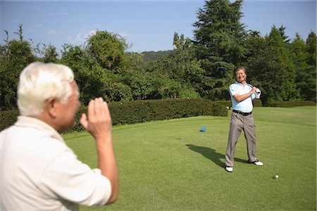 Men playing golf at golf course Stock Photo - Rights-Managed, Code: 858-03049969