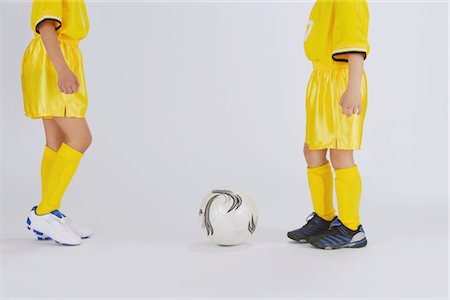 soccer player holding ball - Football players about to kick soccer Stock Photo - Rights-Managed, Code: 858-03050012
