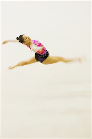 simsearch:858-03448602,k - Young woman performing rhythmic gymnastics Stock Photo - Rights-Managed, Code: 858-03050205