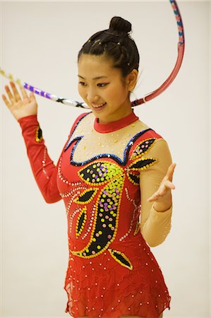 Young woman performing rhythmic gymnastics with hoop Stock Photo - Rights-Managed, Code: 858-03050210