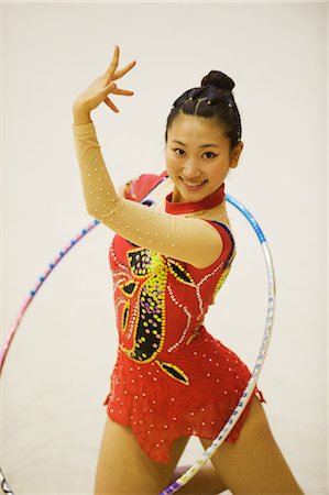 Rhythmic gymnast performing with hoop Stock Photo - Rights-Managed, Code: 858-03050211