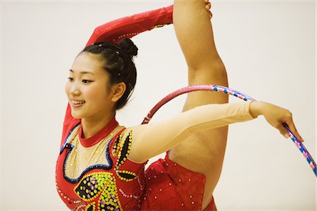 Young woman performing rhythmic gymnastics with hoop Stock Photo - Rights-Managed, Code: 858-03050212