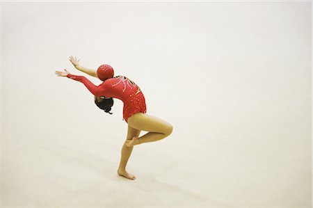 Woman performing rhythmic gymnastics with ball Stock Photo - Rights-Managed, Code: 858-03050223