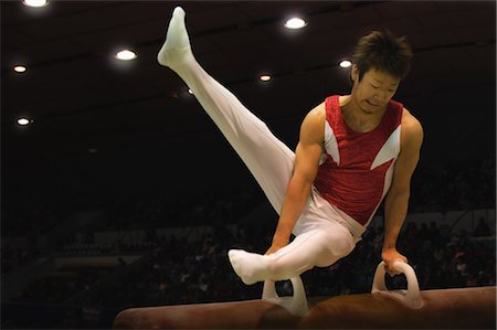 simsearch:858-03050208,k - A male gymnast performing on pommel horse Stock Photo - Rights-Managed, Code: 858-03050236