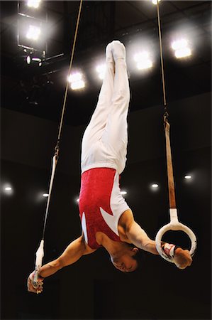 Young male gymnast performing on gymnastic rings Stock Photo - Rights-Managed, Code: 858-03050239