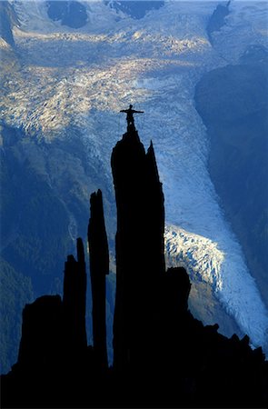 silhouette of man standing in a mountain top - Mountain Climbing Stock Photo - Rights-Managed, Code: 858-03053341