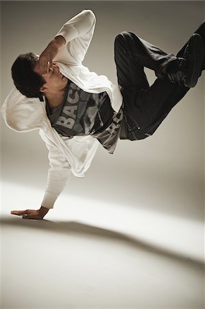 Hip Hop Dancer Performing in Studio Stock Photo - Rights-Managed, Code: 858-03694406