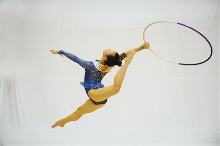 rhythmic - Japanese woman performing gymnastics with hoop Stock Photo - Rights-Managed, Code: 858-03799635