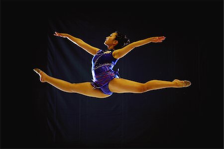 Young adult gymnast performing Stock Photo - Rights-Managed, Code: 858-03799642