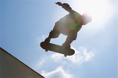 extreme sport not snow not ice not winter - Skateboarder jumping from ramp Stock Photo - Rights-Managed, Code: 858-03799757