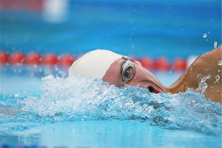 Young man in swimming pool Stock Photo - Rights-Managed, Code: 858-03799769