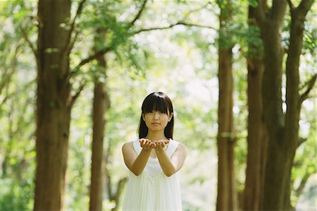 Asian woman in a white dress forest bathing Stock Photo - Rights-Managed, Code: 859-06404913