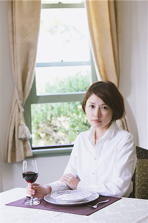 red curtain lady - Japanese woman in a white shirt sitting at a table with a glass of red wine Stock Photo - Rights-Managed, Code: 859-06404933