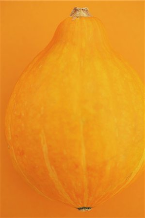 Puccini pumpkin on yellow background Stock Photo - Rights-Managed, Code: 859-06470084