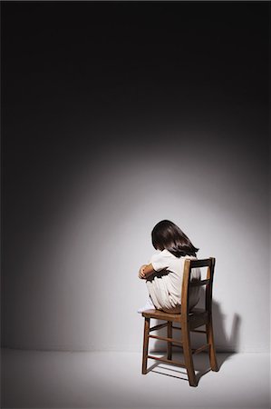 down - Sad girl in a white dress sitting on a chair Stock Photo - Rights-Managed, Code: 859-06537706
