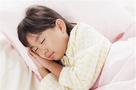 eiderdown - Girl sleeping in bed Stock Photo - Rights-Managed, Code: 859-06537724