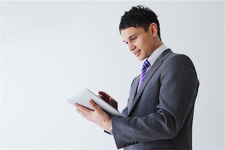 Businessman with tablet Stock Photo - Rights-Managed, Code: 859-06537815