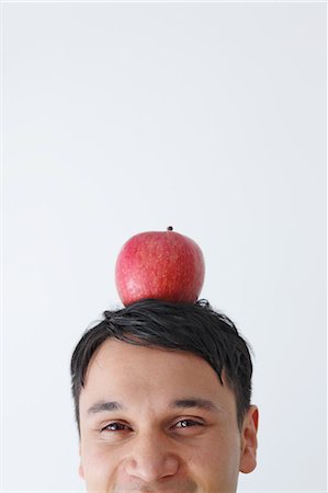 Businessman with an apple on the head Stock Photo - Rights-Managed, Code: 859-06537819