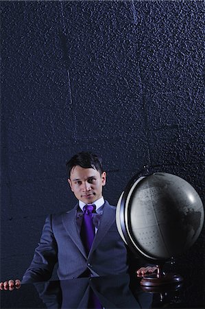 Businessman with globe Stock Photo - Rights-Managed, Code: 859-06537871