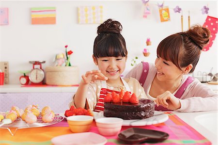 friends cooking inside - Mother and daughter making sweets in the kitchen Stock Photo - Rights-Managed, Code: 859-06537998