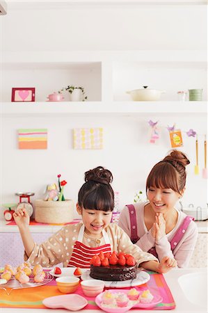 Mother and daughter making sweets in the kitchen Stock Photo - Rights-Managed, Code: 859-06537999