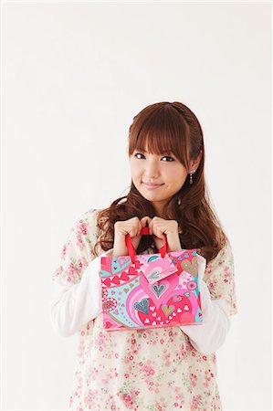 Young woman with gift bag Stock Photo - Rights-Managed, Code: 859-06538014